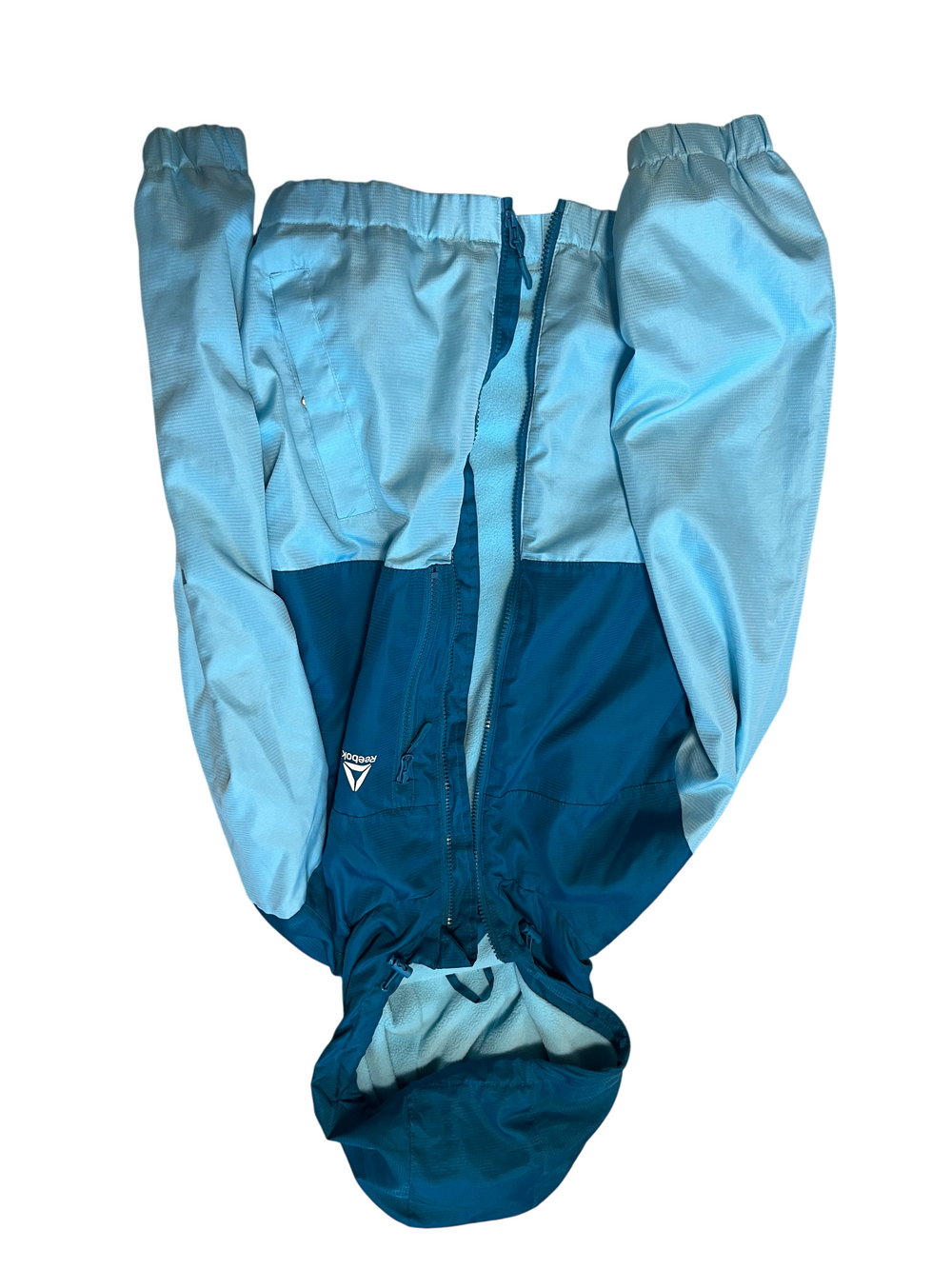 Reebok blue hooded full zip windbreaker jacket with fleece lining and elastic cu